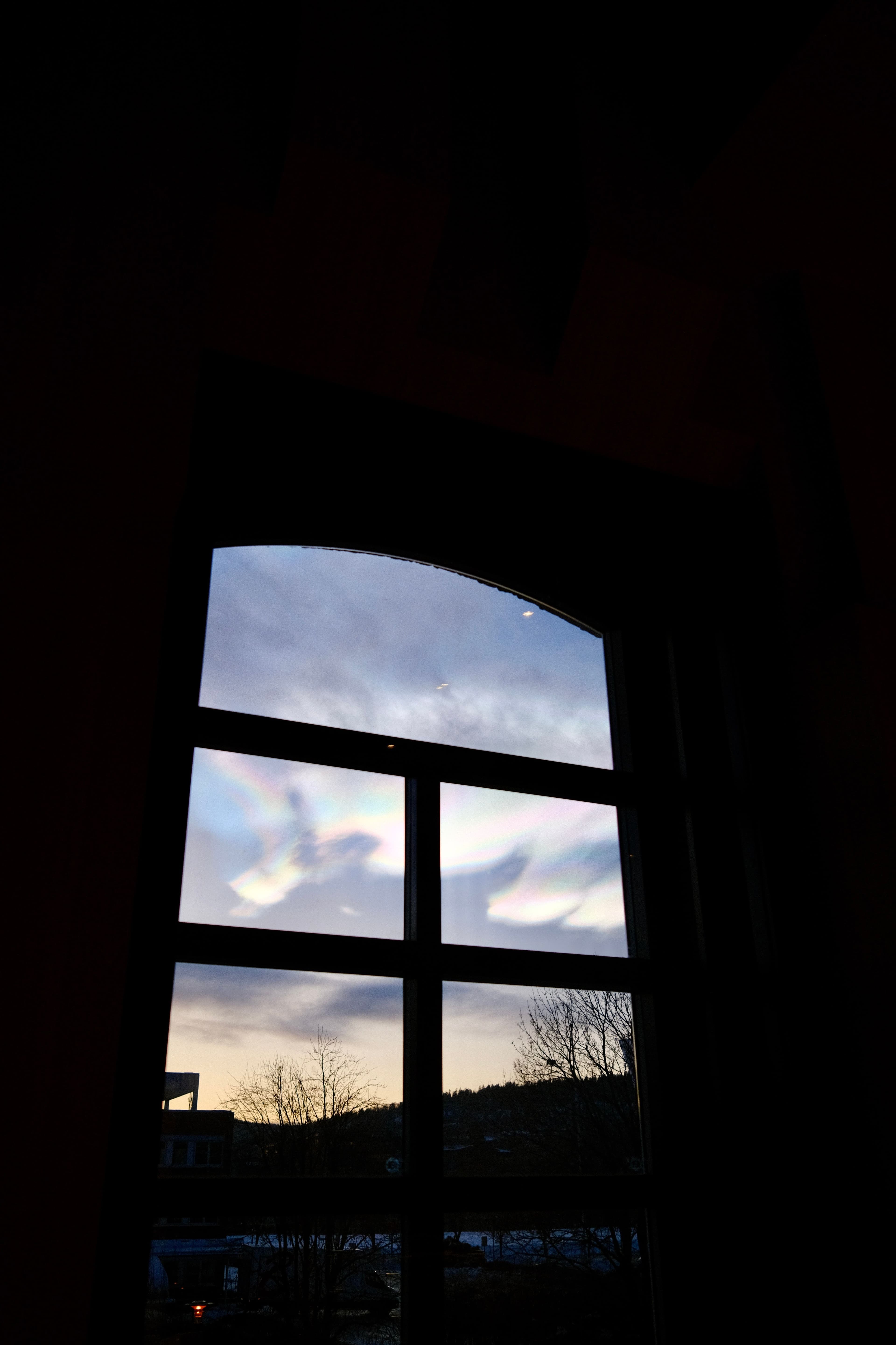 Iridescent sky seen through a window